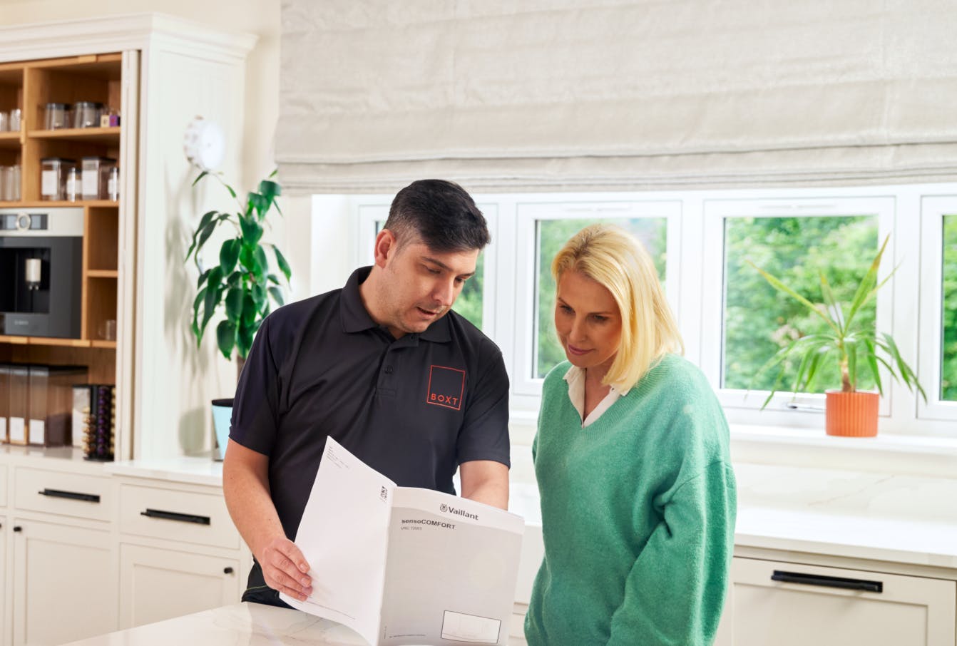 Engineer handing over documents to the customer