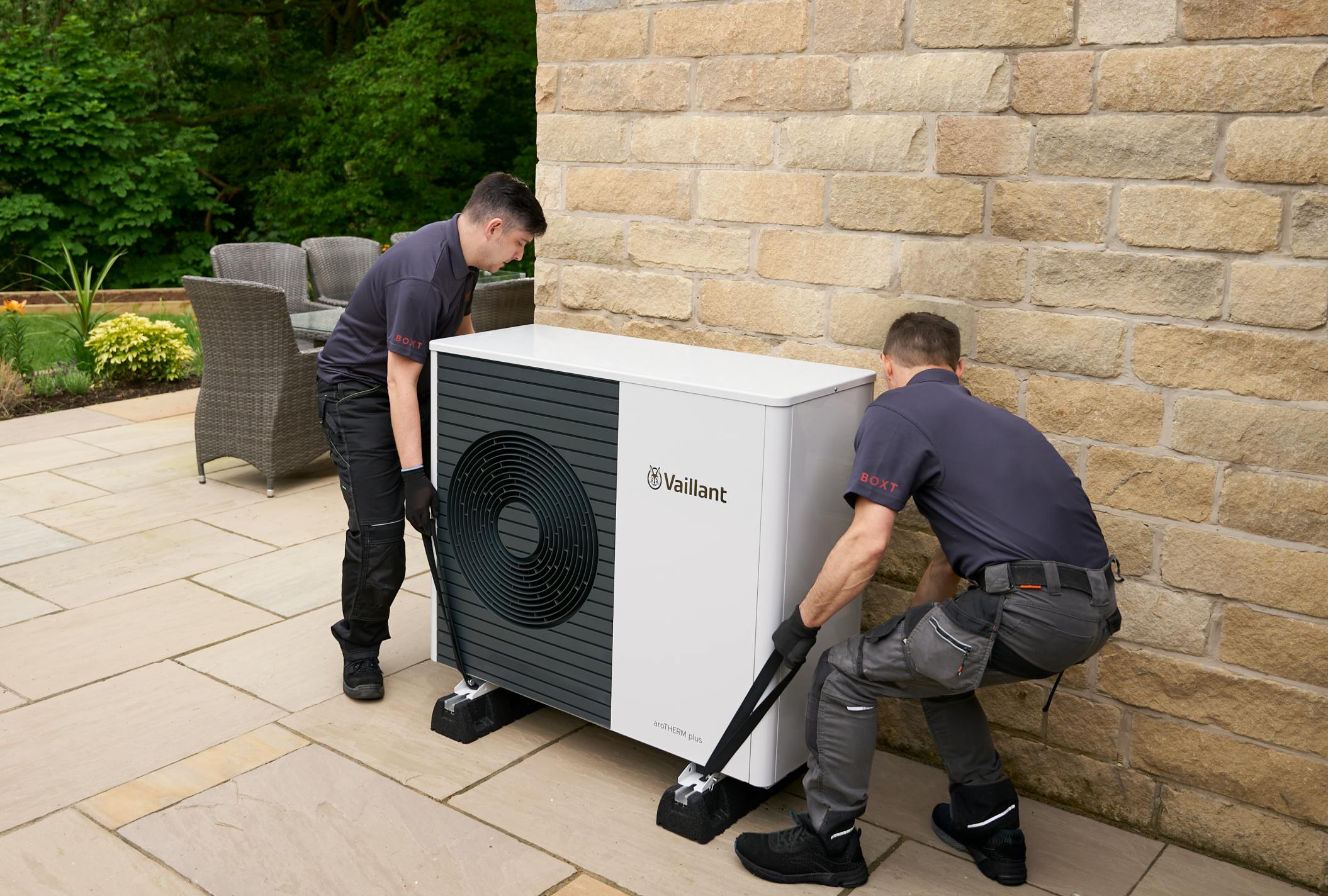 Engineers installing outdoor unit