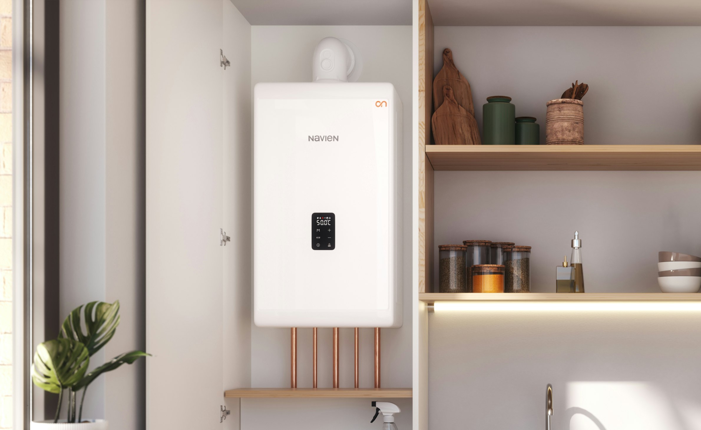 A Navien combi boiler installed in a kitchen cupboard