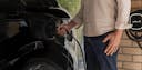 man charging his car