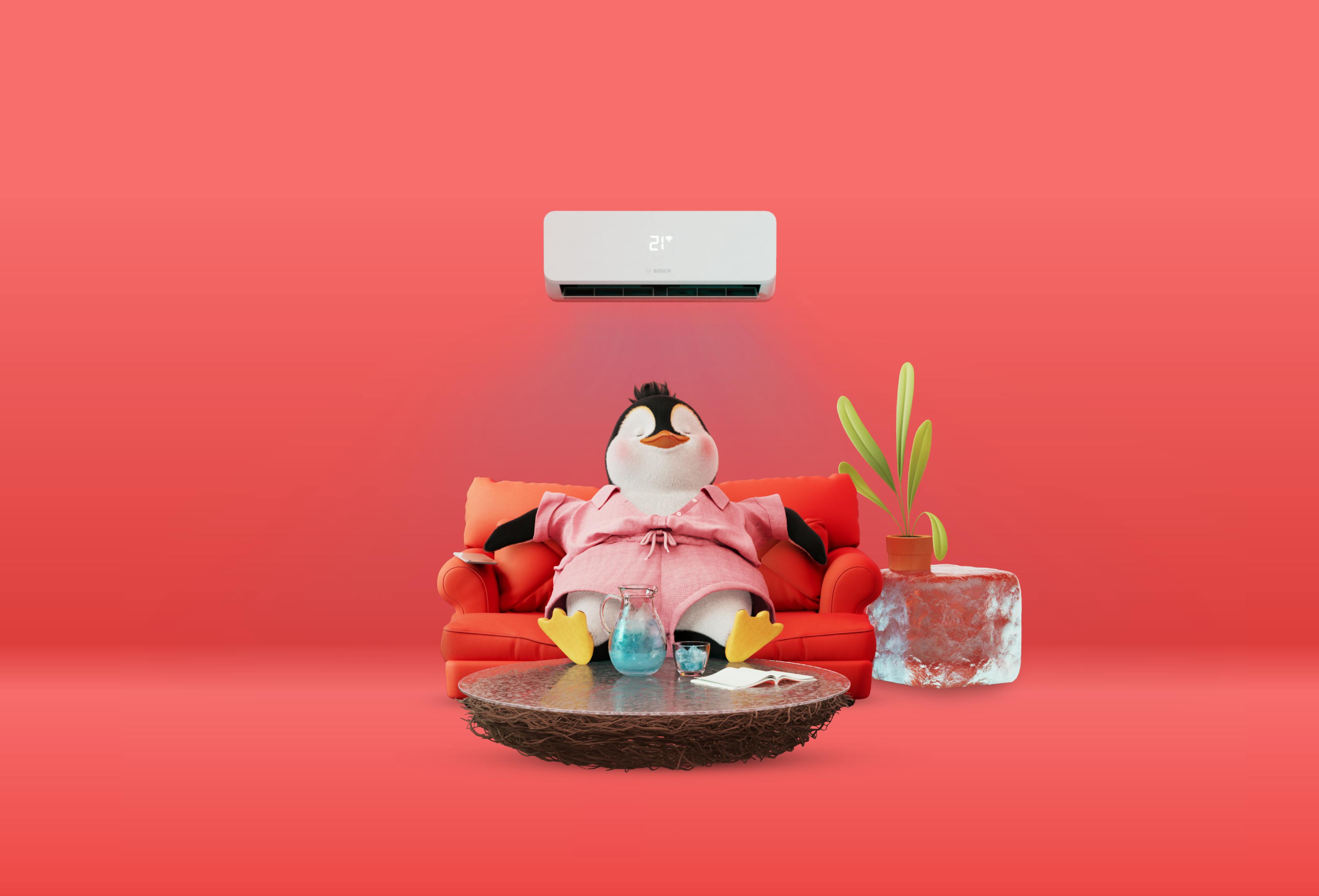 a penguin relaxing on the sofa under an air con unit