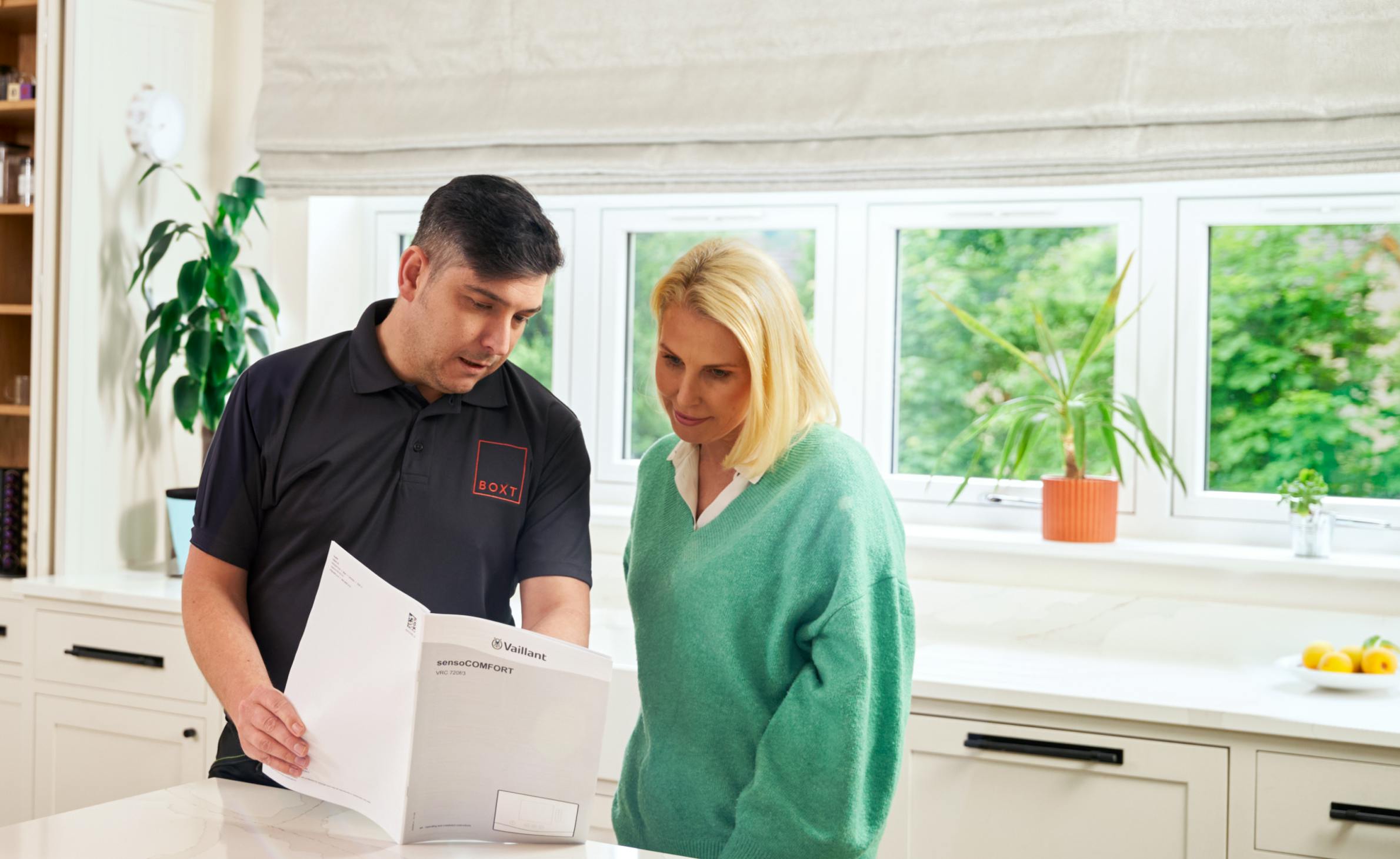 Engineer handing over documents to the customer