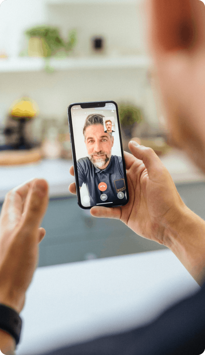 A customer having a video call with a BOXT engineer